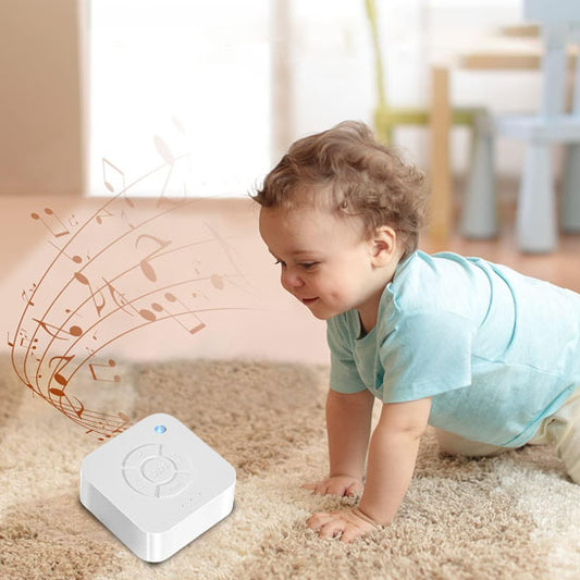 veilleuse-bruit-blanc-avec-lumière-par-terre-sur-tapis-beige--bébé-devant
